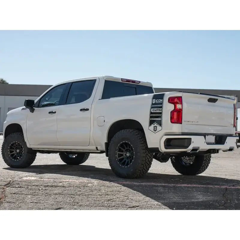 ICON 2019+ GM 1500 1.5-3.5in Stage 2 Suspension System with Tubular Upper Control Arms installed on a white truck.