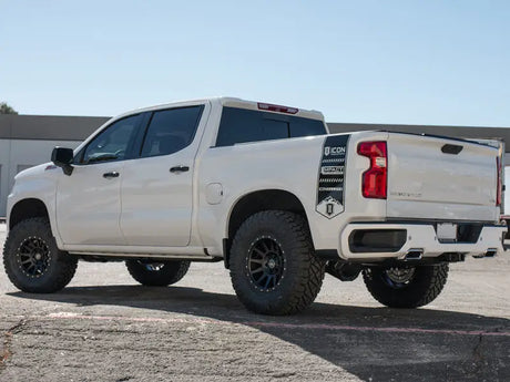 White GM 1500 truck featuring ICON 2019+ Stage 4 Suspension System with Tubular UCA, lifted 1.5-3.5 inches, parked outdoors.