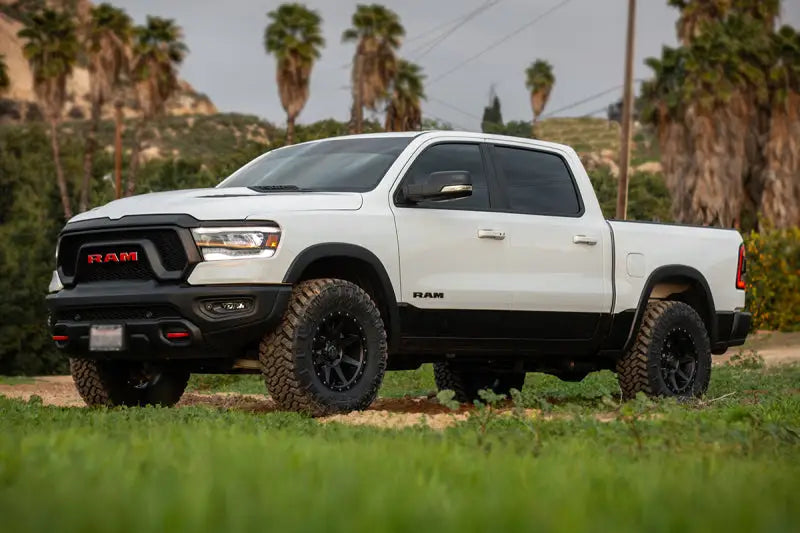 "ICON 2019+ Ram 1500 2/4WD with 0-1.5 inch Stage 1 Suspension System by ICON Vehicle Dynamics, showcased in a rugged off-road setting."