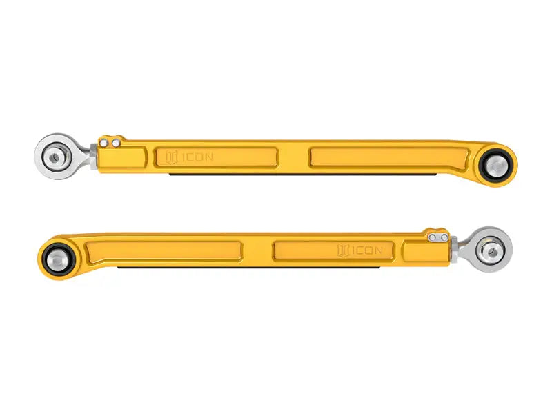 Gold-colored adjustable control arms for ICONs rear lower link kit on Toyota Tundra Tacoma