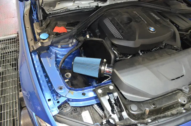 Injen 16-18 BMW 330i B48 2.0L (t) Wrinkle Red Cold Air Intake with blue filter installed in vehicle engine bay. Enhances performance, utilizes advanced MR Technology and Air Fusion, and includes a SuperNano-Web dry air filter.