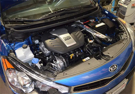 Injen polished cold air intake installed in 2014 Kia Forte Koup 1.6L Turbo engine bay.