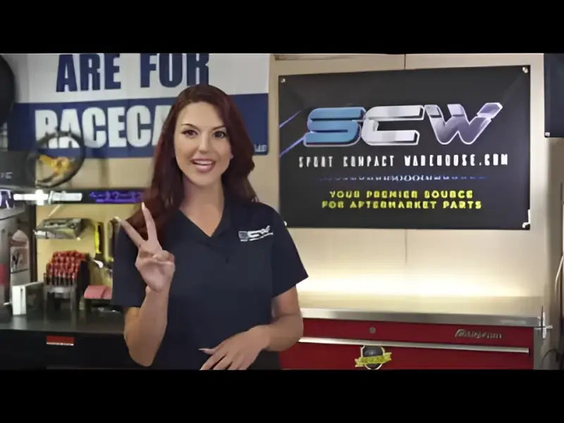 Woman in a garage with IWCC10265BLK Coast2Coast Center Cap for Ford