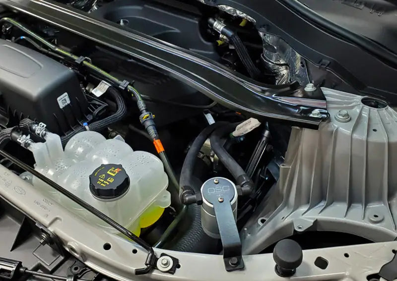 Ford Explorer engine compartment with J&L 2020 EcoBoost oil separator in view