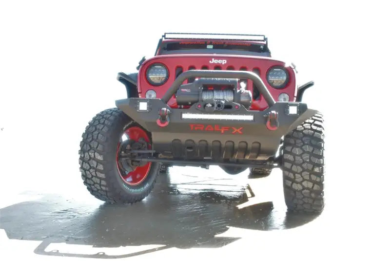 Front view of a red Jeep equipped with the JFBPKG01 Trailfx bumper package, showcasing enhanced durability, style, and off-road capabilities for RV, automotive, powersports, exterior, truck accessories, truck bed, and RV parts, Truck & Automotive, Bumpers, Grilles & Guards, AVADA - Best Sellers