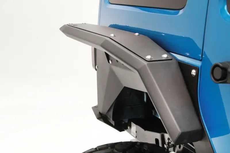 "JK1007-1 Fab Fours Rear Wide Flare installed on a blue 2007-2017 Jeep Wrangler (JK), showcasing robust design and off-road protection."