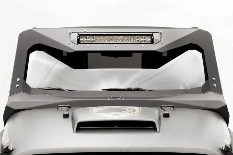Fab Fours JK3022-1 Vicowl Inst 20 installed on a Jeep Wrangler JK (2007-2016), showcasing a sleek, durable visor with integrated LED light bar for enhanced appearance and protection.