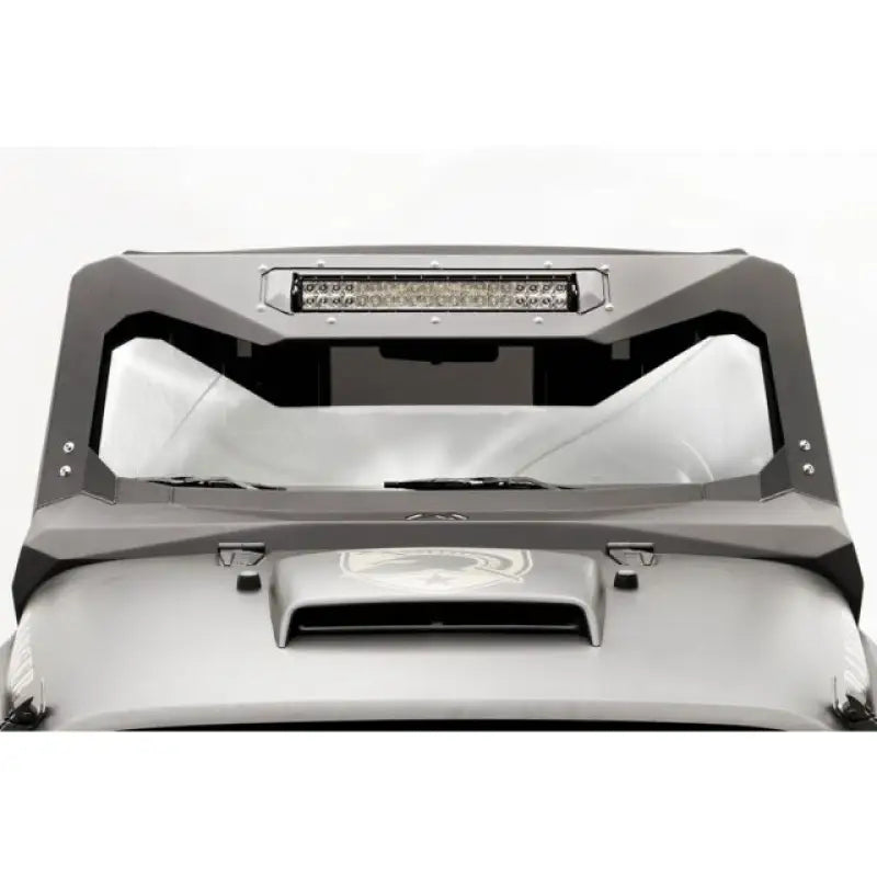 Fab Fours JK3022-1 visor installed on Jeep Wrangler JK 2007-2016, enhancing appearance and providing protection.