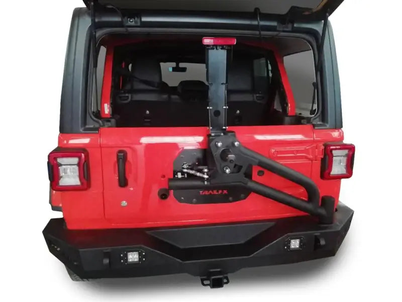 Red Jeep Wrangler with black spare tire carrier on JL03T Trailfx JL Rear bumper