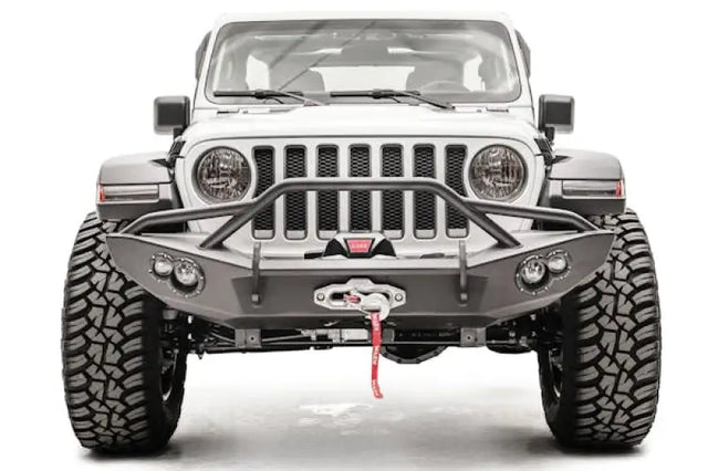 JL18-B4652-1 Fab Fours Lifestyle Winch Bumper with Guard installed on a rugged off-road vehicle’s front.