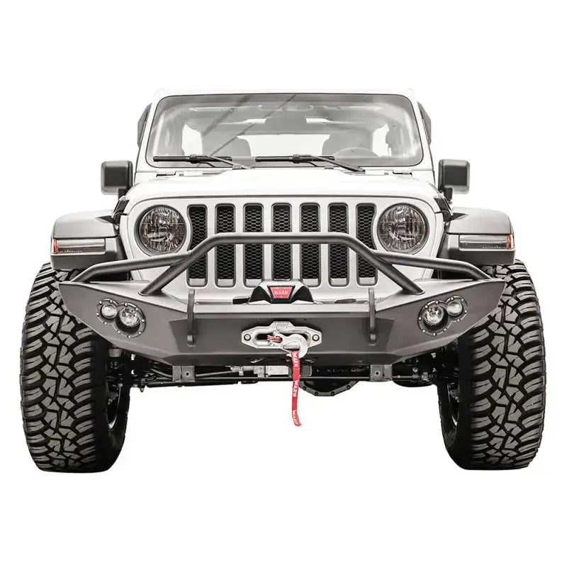 Fab Fours JL18-B4652-1 Lifestyle Winch Bumper with Guard on Jeep, showcasing rugged off-road design and superior protection.