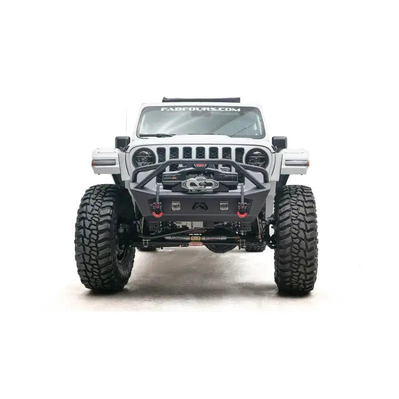 Front view of a white off-road Jeep equipped with JL18-B4752-1 Fab Fours JL/JT Stubby with Pre-Runner Guard for ultimate protection and styling. Sturdy construction for extreme off-road conditions, truck accessories, Bumpers, Grilles & Guards, AVADA - Best Sellers, Must Haves