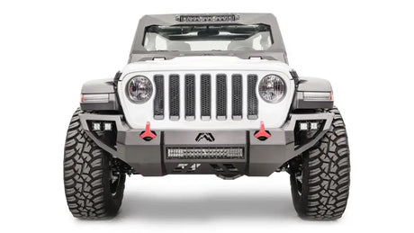Front view of Jeep equipped with Fab Fours Vengeance with Pre-Runner, featuring sleek black finish and aggressive styling for enhanced protection and off-road performance.