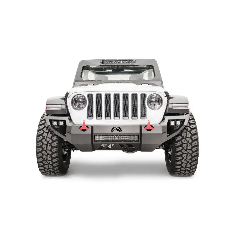 Front view of Jeep equipped with Fab Fours Vengeance with Pre-Runner, featuring sleek black finish and aggressive styling for enhanced protection and off-road performance.