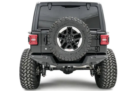 Fab Fours 18 Jp Jl Rear Base on Jeep Wrangler, showcasing added protection and rugged style.