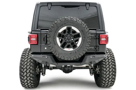 Fab Fours 18 Jp Jl Rear Base (JL18-Y1851-1) installed on a Jeep Wrangler, providing enhanced protection and rugged style for tough off-road conditions.