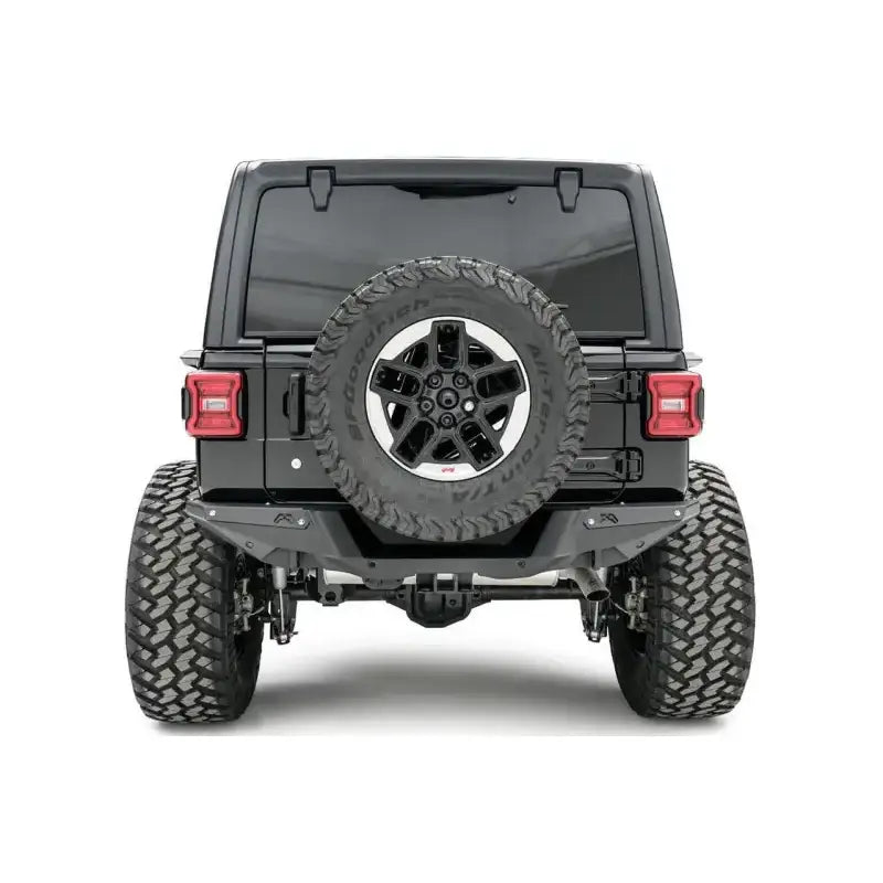 Fab Fours 18 Jp Jl Rear Base on Jeep Wrangler, showcasing added protection and rugged style.