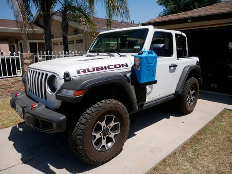 White Jeep Rubicon with blue Fuel Container mounted by Mor Ryde Jerry Can Mount