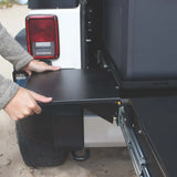 Pull-out table attached to vehicle for Mor Ryde Trail Kitchen setup