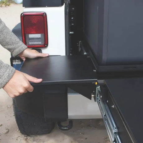 Pull-out table attached to vehicle for Mor RYDE Trail Kitchen setup