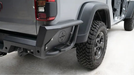 JT20-Y1950-1 Fab Fours Gladiator Rear bumper installed on a rugged off-road vehicle showcasing superior protection and aggressive styling.