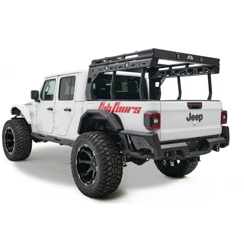 JT20-Y1950-1 Fab Fours Gladiator Rear bumper on white Jeep Rubicon, showcasing superior protection, aggressive styling, and rugged off-road durability.