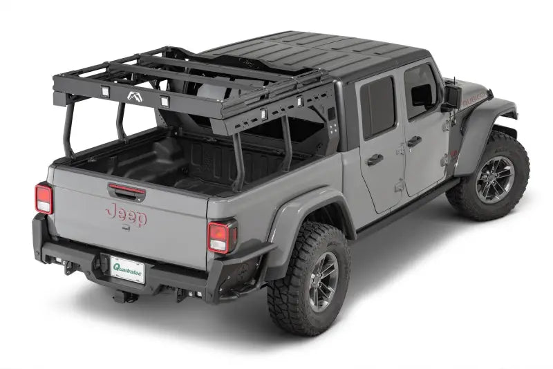 JTOR-01-1 Fab Fours Gladiator Overland Rack installed on a gray Jeep Gladiator showcasing its durable construction, ample storage, custom fit, enhanced utility, and sleek design.