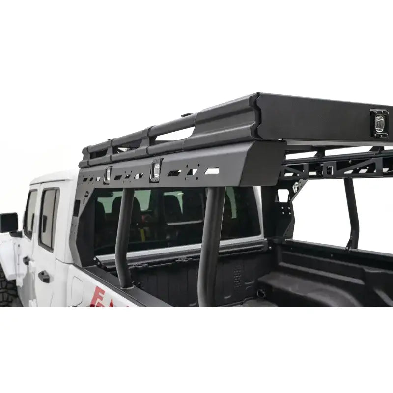 JTOR-01-1 Fab Fours Gladiator Overland Rack mounted on Jeep Gladiator, showcasing durable construction, aerodynamic design, and ample storage for off-road adventures.