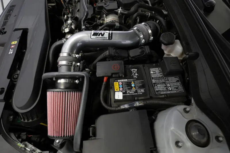 K&N 21-22 Kia K5 L4-1.6L Typhoon Air Intake installed in engine bay, featuring mandrel-bent aluminum tube and high-flow air filter for increased horsepower and torque. Ideal for RV, automotive, powersports, off-road, marine, truck accessories, racing, riding, and bmx.