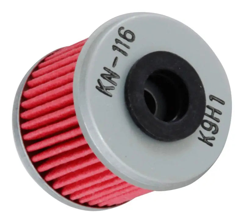 Red K&N oil filter for Honda and Husqvarna with pleated design