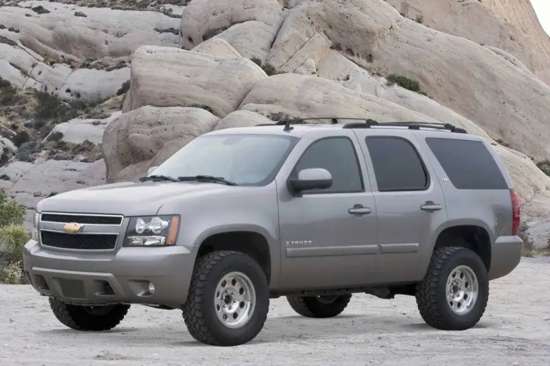 Silver Chevrolet Tahoe SUV with K1060DL Fabtech Lift Kit Suspension for off-road style