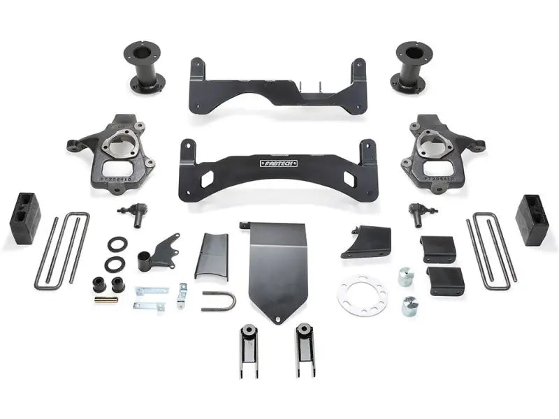 K1094 Fabtech Lift Kit Suspension components laid out for installation, showcasing increased ground clearance and larger tire capability for enhanced off-road performance.