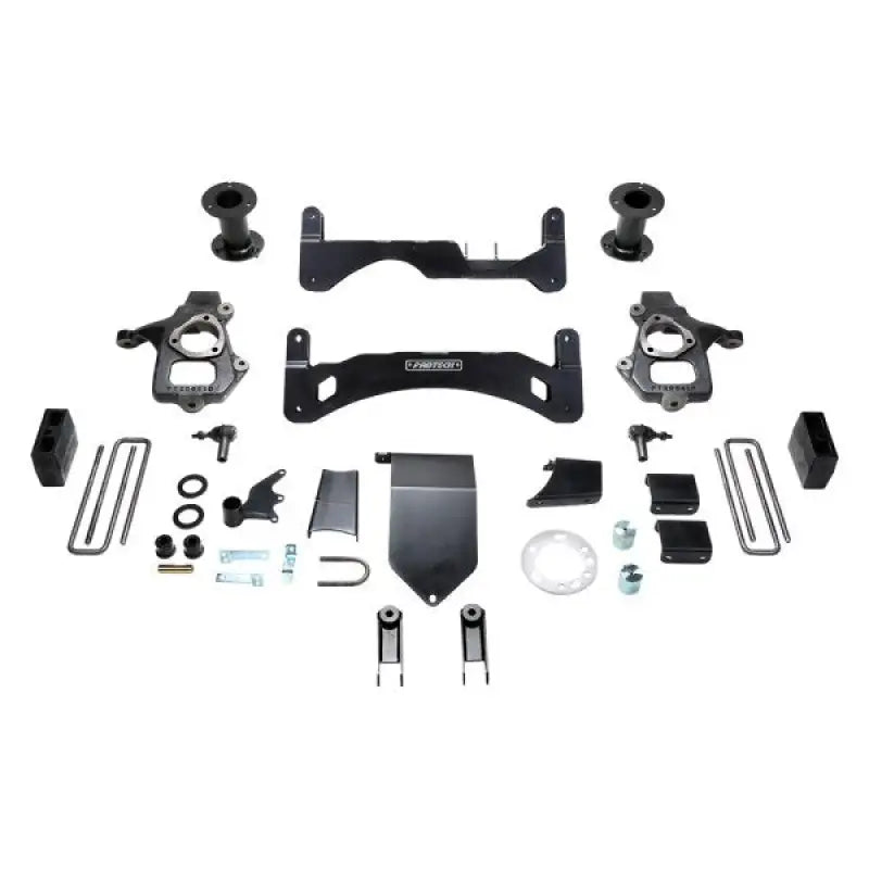 K1100 Fabtech Lift Kit Suspension components laid out on a white background, showcasing parts including brackets, spacers, and hardware for vehicle suspension enhancement.