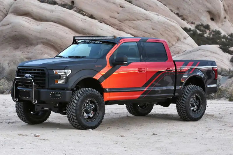 Fabtech 2015 Ford F150 4X4 with K2194 suspension lift kit in rugged off-road setting.