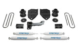 K2213 Fabtech Lift Kit Suspension components for vehicle upgrade, including shock absorbers, mounting brackets, U-bolts, and additional hardware for enhanced off-road performance and larger tire fitment.
