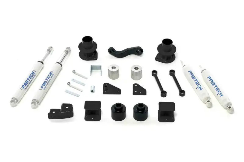 Fabtech K4037 Lift Kit Suspension components for enhanced vehicle performance and off-road capability laid out on a white background.