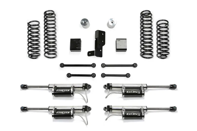 K4108DL Fabtech Lift Kit Suspension parts laid out, including springs, shock absorbers, and mounting components.
