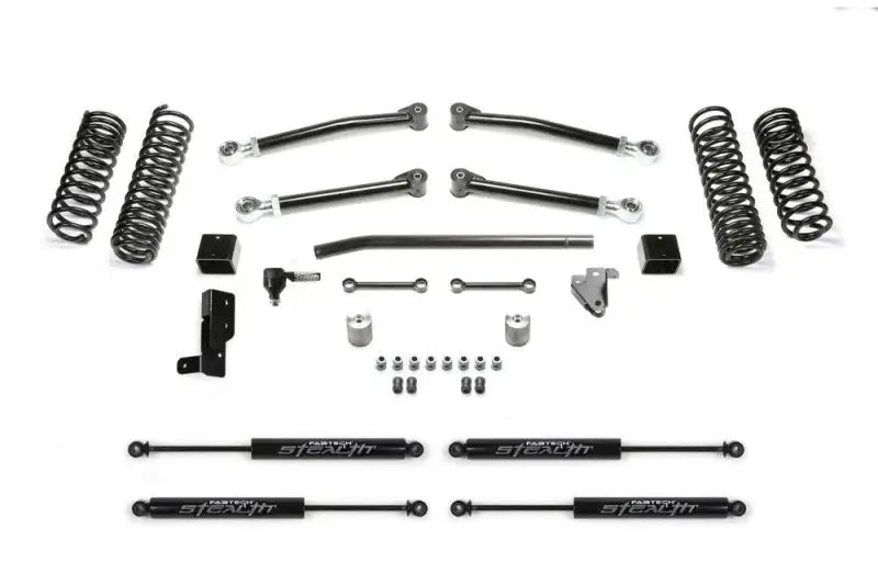 K4117M Fabtech 3' Trail W/Stlth lift kit for 2018 Jeep Wrangler JL 4WD 4-door, featuring high-quality components for enhanced ground clearance and rugged off-road performance.