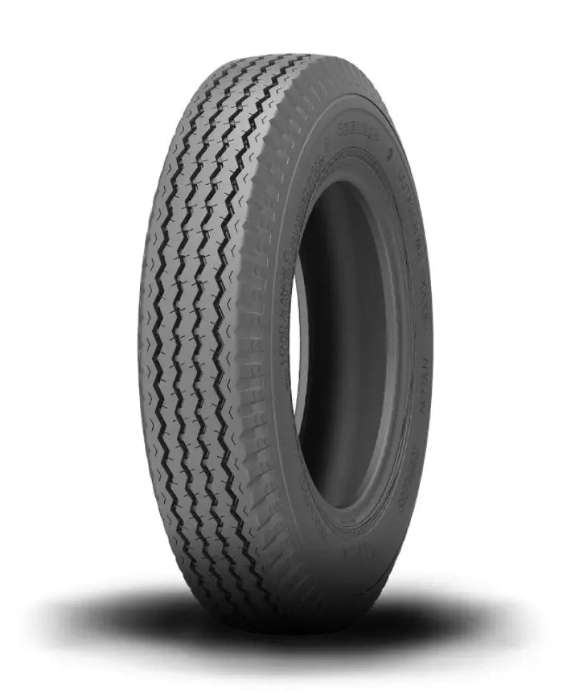 Gray tire with zigzag tread from Kenda K353 Load Star Utility Bias Tires