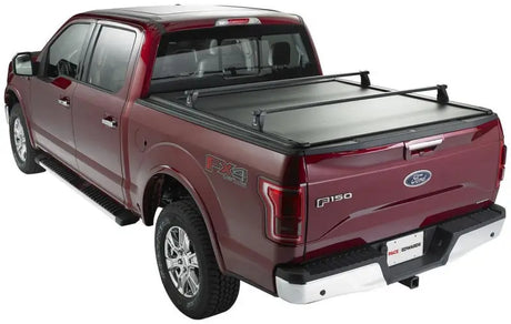 2019 Ford F-150 XLT pickup with black vinyl tonneau cover and silver roof rack, KMN182 Pace Edwards Ultragroove Metal Kit