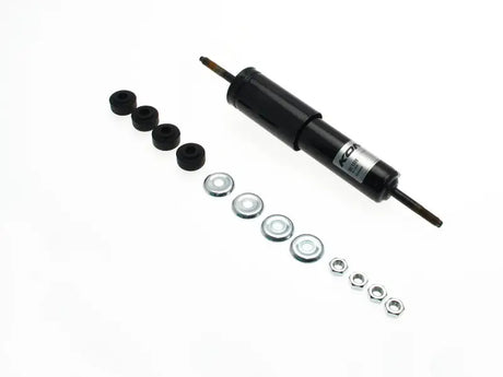 Black shock absorber with mounting hardware.