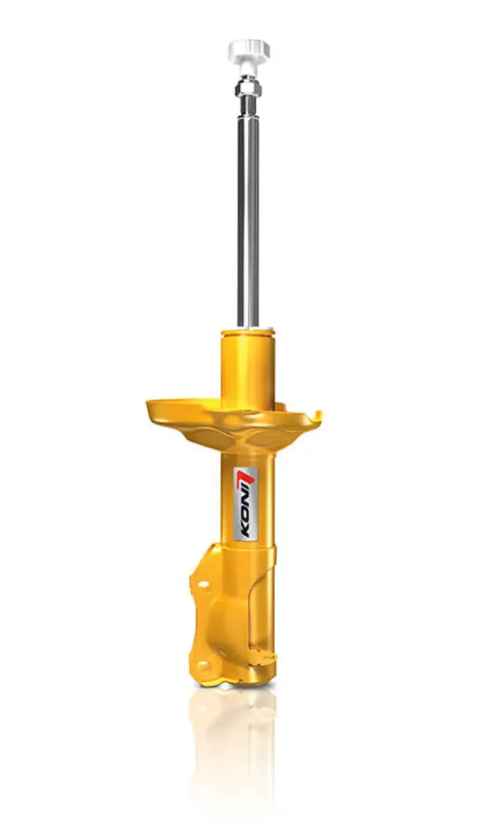 Yellow automotive shock absorber.