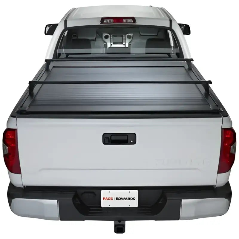 White pickup truck with bed cover featuring KRF171 Pace Edwards Ultragroove Kit