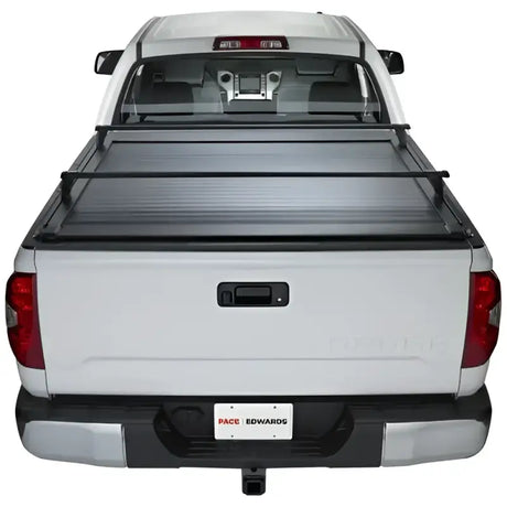 White pickup truck with bed cover featuring KRF171 Pace Edwards Ultragroove Kit