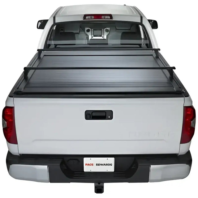 White pickup truck with bed cover featuring KRF171 Pace Edwards Ultragroove Kit