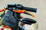 Motorcycle handlebar with orange brake lever and black mirror, Kuryakyn ISO levers