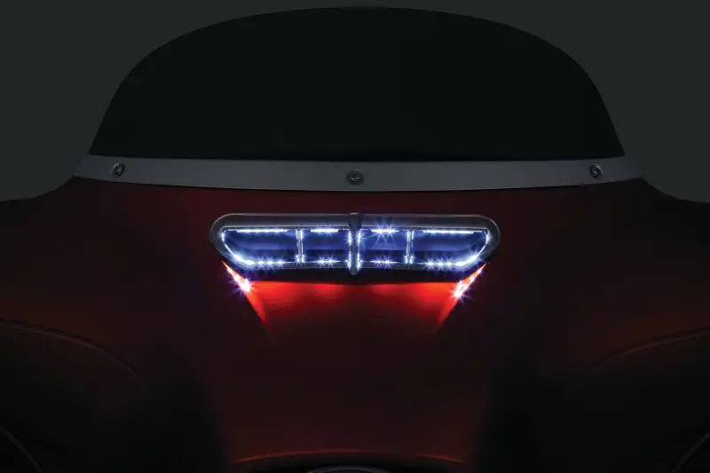 Chrome Kuryakyn fairing vent accent on 2019 BMW M5 rear light