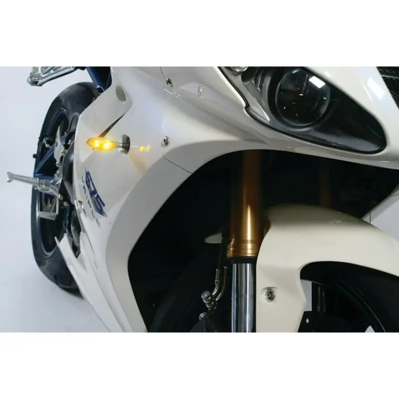 White motorcycle front fairing with Kuryakyn Micro 1000 clear lens amber chrome