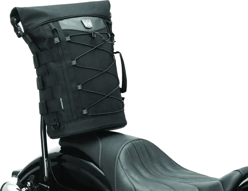 Black Kuryakyn Momentum Deadbeat Duffle Bag mounted on a motorcycle seat, ideal for RV, automotive, powersports, off-road, and marine adventures, featuring rugged exterior and versatile use as truck accessories and interior storage, truck bed, and RV parts, AVADA - Best Sellers, Bags & Packs, Bags - Bike Bags