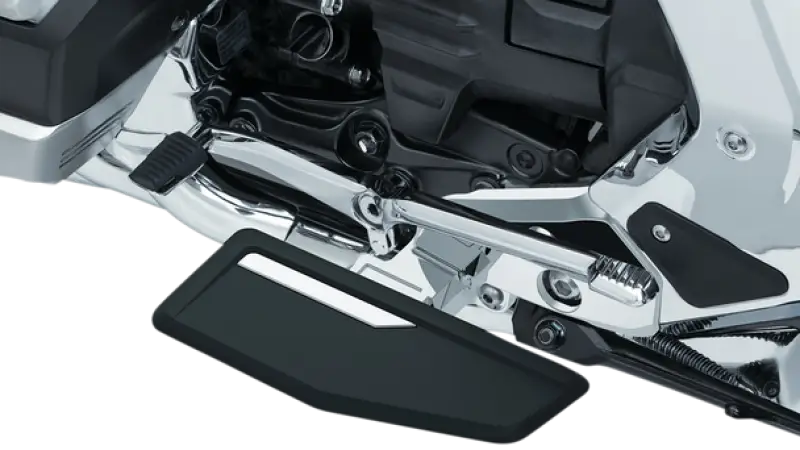 Kuryakyn Omni Driver Floorboards Chrome showing motorcycle footrest with chrome accents